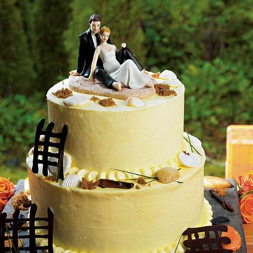 Bride and Groom Sitting on Beach Sand Wedding Cake Topper