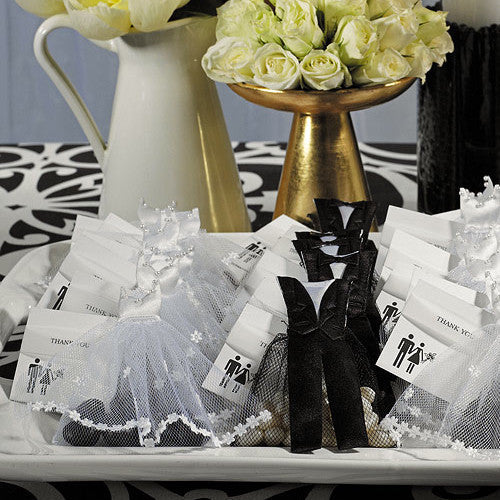 A beautiful display of the Groom & Bride Wedding Favor Candy Bags with yellow flowers.The bags are filled with candy and jelly beans.