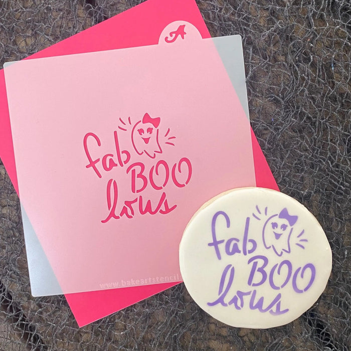 FabBOOLous Cookie Stencil shown decorated on a white sugar cookie with the design in purple and laying a black Halloween netting