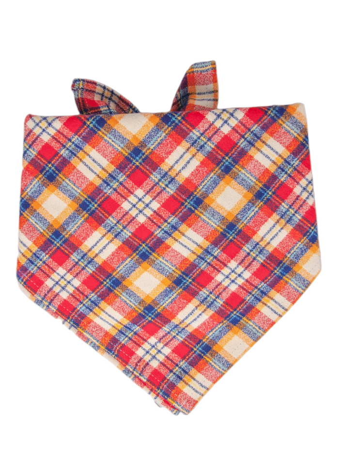 Colorful flannel dog bandana with a traditional plaid print in warm tones. The fabric is folded into a triangle and tied at the top, making it a stylish and comfortable accessory for pets during cooler seasons or festive occasions.