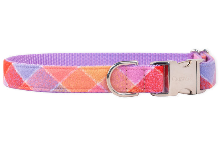 Flannel dog collar in a cheerful multicolor plaid pattern. The metal hardware includes a curved quick-release buckle engraved with “Crewlala” and a matching leash ring. Interior is lined with durable nylon woven webbing.