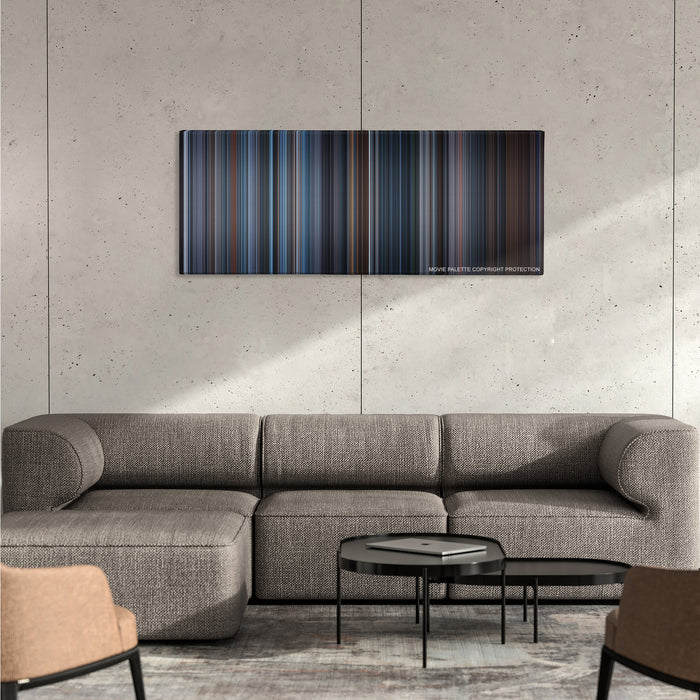 Hannibal color palette canvas on a concrete wall above a gray sectional sofa