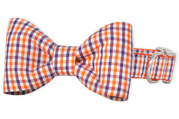 A classic plaid bow tie in bright orange gingham print, attached to a matching adjustable collar. This statement piece adds instant polish and personality to your pup’s look.