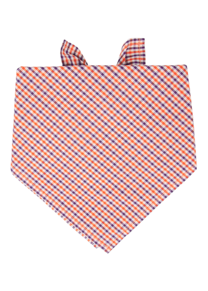 This vibrant plaid dog bandana adds instant flair with its bold orange gingham print. The easy slip-on design pairs perfectly with matching accessories for a polished, picture-ready outfit.