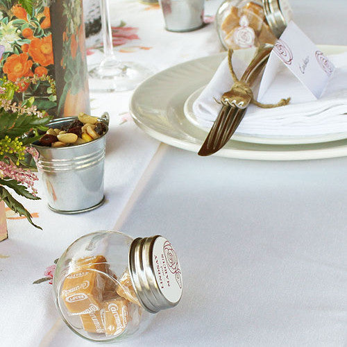 Mini Glass Jars filled with caramels (caramels not included.).
