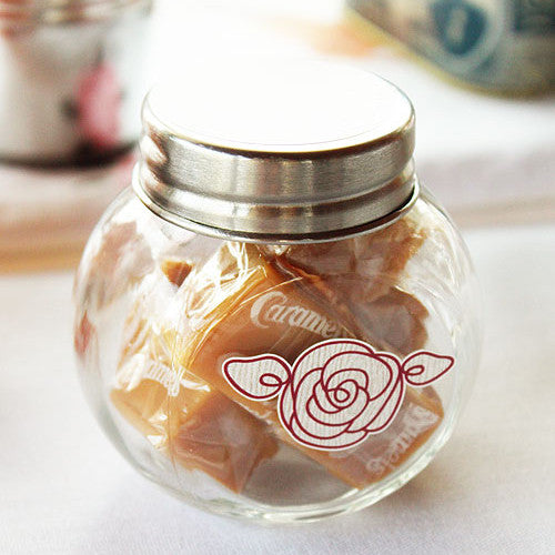 Mini Glass Jars filled with caramels and decorated with a flower sticker (caramels and sticker not included.).